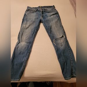 Women's distressed jeans, skinny boyfriend styling